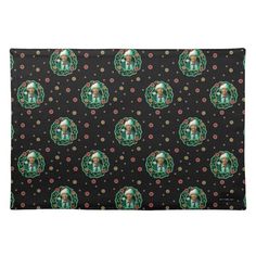 a black place mat with green and red skulls on it, surrounded by polka dots