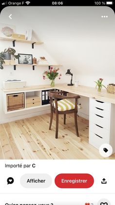 an iphone photo of a desk and chair in a room with white walls, wood floors and open shelving