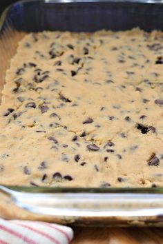 a baking dish filled with batter and chocolate chips