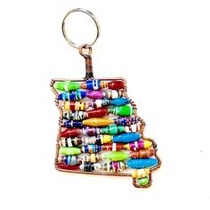 a keychain made out of many different colored pens