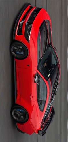 an overhead view of a red sports car