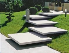 a set of concrete steps next to a swimming pool