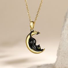 Black cats are often a symbol of Halloween or witchcraft. In most Western cultures, black cats have typically been looked upon as a symbol of evil omens, specifically being suspected of being the familiars of witches, or actually shape-shifting witches themselves. Made from sterling silver, the pendant features a black cat stretching over a crescent moon. The perfect gift for a cat lover.Weight: 2.8 gWidth: 13.9 mmHeight: 18.1 mmThickness: 4.4 mmMaterial: 925 SilverPlating Color: Black, Yellow G Black Cat Stretching, Black Cat Jewelry, Dream Accessories, Black Cat Necklace, Crescent Moon Jewelry, Cat Stretching, Shape Shifting, A Black Cat, Moon Jewelry