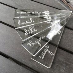 four clear acrylic signs with words on them