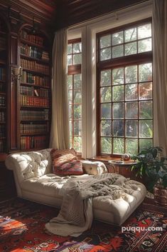 a living room filled with lots of books and furniture next to a large open window