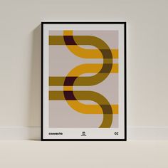 a framed poster with the letter s in yellow, brown and black on a white wall