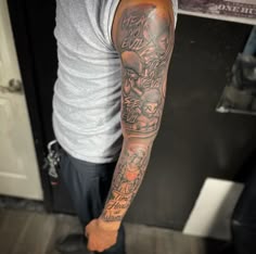 a man with a tattoo on his arm