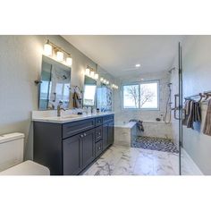 a bathroom with marble floors and white walls