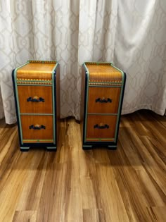 two nightstands sitting side by side on top of a wooden floor