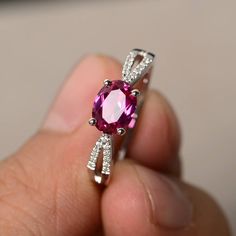 This is a gorgeous handmade creation. Its beauty is its simplicity & Elegance. The 6*8 mm oval shape faceted lab Ruby is crafted in solid sterling silver and with rhodium plated. Main stone weight about 1.75 ct. CZ as accents. All item is sent in a beautiful gift box If you have any idea of design your ring,pls contact me directly. You can realize more lovely stuff clicking the link https://www.etsy.com/shop/knightjewelry?refshopsection_shophome_leftnav Please leave the correct address and y Oval Ruby Ring For Wedding And Promise, Elegant Oval Ruby Ring For Gift, Oval White Gold Birthstone Ring, Oval Ruby Rings For Gift, Oval Ruby Rings Suitable For Gifts, Oval Ruby Ring With Prong Setting For Promise, Oval Ruby Ring With Halo Design For Promise, Elegant Oval Ruby Birthstone Ring, White Gold Ruby Ring With Accent Stones, Oval Shaped