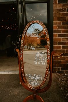 Hand painted antique mirror wedding welcome sign. Whimsical fall wedding sign. Wedding welcome sign hand painted by Shelby McNeil, Photo by White Pine Media  #wedding #weddingwelcomesign #weddingmirror #weddingmirrorwelcomesign #weddingfloral #weddingwishes #welcometoourwedding #weddingdecorinspiration #weddingdeco #whimsicalwedding #floralwedding #fallweddingtrends #floralwelcomesign #weddingsignsforreception #weddingsignage #weddingsign #thriftedwedding #thrifteddecor #diyweddingideas #diyweddingbackdrop #diyweddingsign #welcomeweddingsign Whimsical Fall Wedding, Mirror Welcome Sign, Fall Wedding Sign, Fall Wedding Trends, Whimsical Fall, Mirror Wedding, Wedding Welcome Board, Whimsical Wedding Decorations, Wedding Mirror