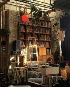 a living room filled with furniture and lots of books