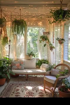 a porch with lots of plants and lights