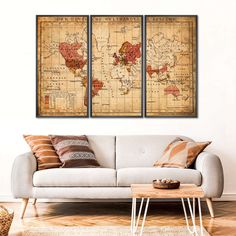 a living room with two couches and a map on the wall