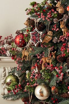 a christmas tree decorated with ornaments and pine cones