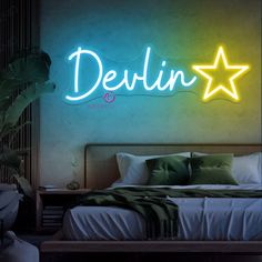 a neon sign that reads delin on the wall above a bed in a bedroom