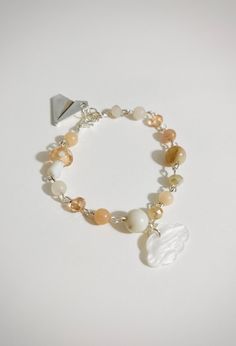 Introducing our Cloud Charm Bracelet - a timeless piece designed to bring tranquility and elegance to your everyday style. ☁️✨ Crafted with care and attention to detail, each bracelet features delicate charms inspired by nature's beauty and the serenity it brings. From calming waves to graceful leaves, every charm is a symbol of peace and harmony. 🌊🍃 The combination of high-quality materials and thoughtful design ensures that our Serene Charm Bracelet is not only a fashion statement but also a Charm Bracelet Aesthetic, Cloud Bracelet, Bracelet Aesthetic, Symbol Of Peace, Peace And Harmony, Look Plus, Everyday Style, Nature Beauty, Arm Band