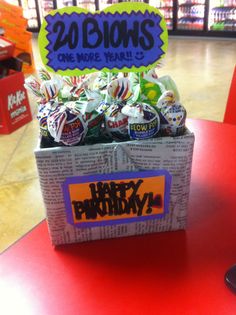 a birthday card box with candies in it on a table