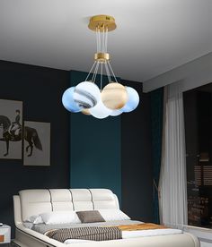 a modern bedroom with blue walls and white bedding, two round lights hanging from the ceiling