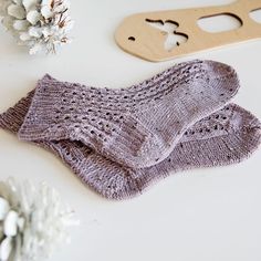 The Bliss Lace Knit Socks Pattern combines the elegant single eyelet rib stitch with a stockinette sole. The result is a stunning pair of cozy socks that will keep your toes blissfully warm in the cooler months! Materials: US size 1 (2.25 mm) circular knitting needles (min 32” cord for magic loop method), or double pointed knitting needles. Knit Picks Stroll Tweed fingering weight sock yarn in Lavender Field Heather. Socks in photo are for size 9 feet and required just under 1 skein (230 yards) for two socks. Scissors. Stitch marker. Tapestry/yarn needle. Size: Width is for a typical Adult Female Foot. Length of foot can be customized in pattern. Skill Level: Intermediate Knitting Patterns Lace, Knit Socks Pattern, Leg Warmers Knitting Pattern, Sock Yarn Knitting Patterns, Knit Leg Warmers Pattern, Socks Knitting Pattern, Crochet Washcloth Pattern, Double Pointed Knitting Needles, Socks Knitting