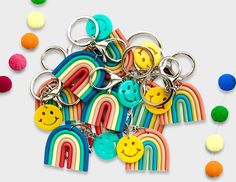 a bunch of key chains with smiley faces on them