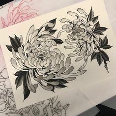 two drawings of flowers on paper next to each other, one is black and white