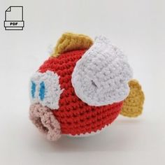 a crocheted fish toy is shown on a white background