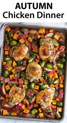 a pan filled with chicken and veggies on top of a table