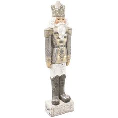 a statue of a nutcracker wearing a suit and hat