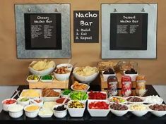 a buffet table filled with different types of food and snacks on it's sides