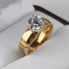 a gold ring with a diamond in it