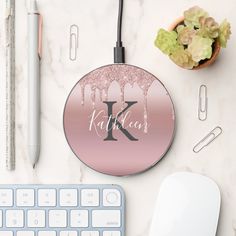 a personalized monogrammed mouse pad with the letter k on it next to a keyboard