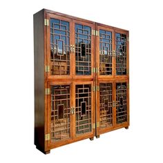 a wooden cabinet with glass doors on the front and side panels inlayed to each other