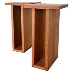 two wooden tables sitting side by side with one end open and the other half closed