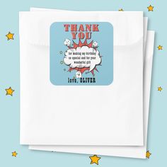 two white envelopes with the words thank you and an image of a comic character