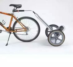 an orange bicycle with two wheels on it