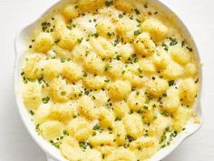 a casserole dish filled with potatoes and parsley