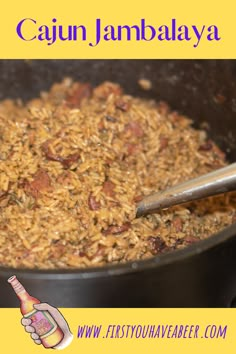 a bowl full of food with a spoon in it and the words cajun jambaalaya above it