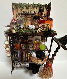 a shelf filled with lots of assorted items and witches hats on top of it