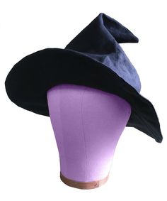 a purple and black hat on top of a mannequin head