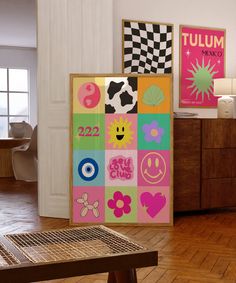 a room with wooden floors and colorful artwork on the wall