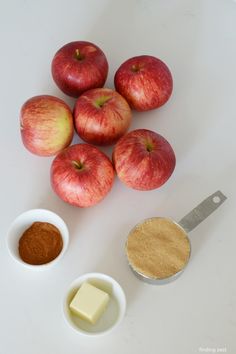 apples, butter and other ingredients on a white surface