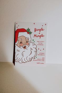 a christmas card with a santa clause on it's face and the words ginger mingle