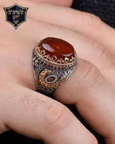 "Red Agate Silver Ring, Mens Handmade Ring, 925 Sterling Silver Ring, , Gift for Men, Turkish Ring, Ottoman Mens Ring ✦ Details ✦ * Material: 925 Sterling Silver * Gemstone: Agate * Weight: 14.00 grams * The size of the stone: 13x18 mm. * Sides oxidized, decorated with Garnet stones and Micro Zircon stones. * Stamp: 925 * Available sizes; 5 US to 16 US. Contact me if you need any other size! ✦ Shipping ✦ * Processing time: 1-3 business days. * This item ships from my Turkish workshop in Istanbul. * Add your phone number in address box for a smoother delivery. That makes courier personnel's job easier.  ✦ Packaging ✦ * Comes with a luxury gift box and a jewellery cleaning cloth and courtesy gift. ✦ Returns, Exchanges ✦ * Return option available for 30 days after the delivery. * The product Ottoman Ring Men, Man Rings, Turkish Ring, Turkish Rings, Ring Mens, Garnet Stone, Mens Ring, Red Agate, Luxury Gift Box