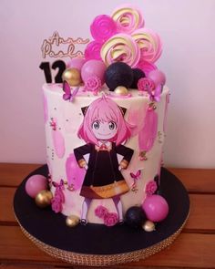 a birthday cake decorated with pink and gold decorations