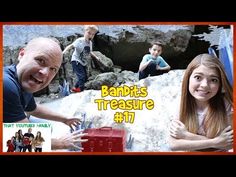 a man and woman are posing for a photo in front of a red box with the words banks's treasure on it