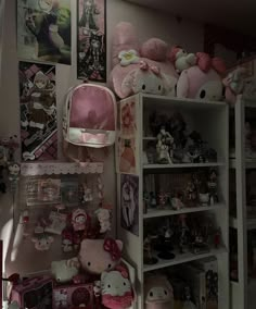 a room filled with lots of stuffed animals and other stuff items on the wall next to bookshelves