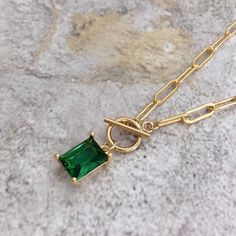 * DETAILS * * Gold Filled Necklace - Copper Based with 14K Gold Filled Chain - 14K Gold Filled Toggle Clasp 9mm - Gold Plated Emerald Crystal Glass Pendant 9mm*7mm - 14K Gold Filled Link Rings 👉🏻 You may also like the matching earrings in the photos. Here is the link. https://www.etsy.com/JinnysJewelryBySeJin/listing/955323557/emerald-huggie-earrings?utm_source=Copy&utm_medium=ListingManager&utm_campaign=Share&utm_term=so.lmsm&share_time=1612684001759 * WHAT IS GOLD FILLED * Go Stone Pendants Gold, Green Gemstone Pendant Necklace, Gold Emerald Gemstone Necklace Gift, Elegant Gold-plated Emerald Pendant Necklace, Elegant Emerald Pendant Gemstones, Green Gemstone Necklace With Rectangular Pendant, Emerald Pendant Necklace, Emerald Green Necklace, Emerald Necklace Pendant