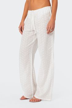 Pants Straight leg Adjustable drawstring waist Cotton lace fabric 100% Cotton Model wears size S Model height is 5'8 Item care: Wash with similar color Rhode Island Summer, Eyelet Pants, White Beach Pants, Pants Low Waist, Cutest Clothes, Vacay Fits, Greece Trip, Summer Trousers, Eyelet Fabric