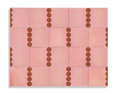 a pink and brown tile with circles on it